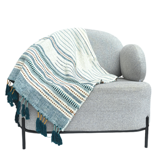 White throw with blue stripes and dots