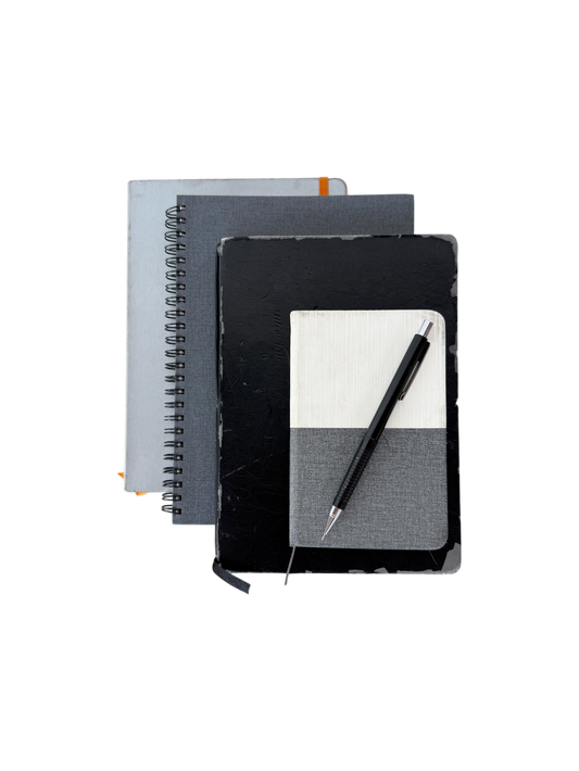 Black, white and grey notebooks