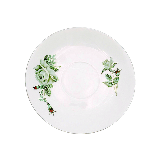 White porcelain plate with green flower